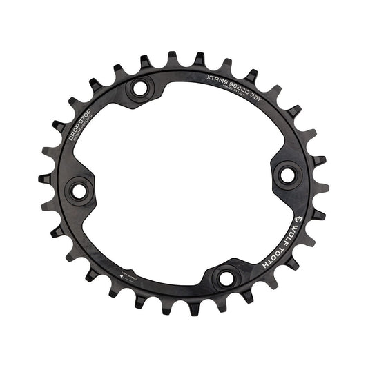 Ovales Einfach-Kettenblatt WOLF TOOTH ELLIPTISCH 96 BCD 11-fach Shimano XTR M9000/9020, 4-Loch, 96 mm, Schwarz — Kettenblatt auf weißem Hintergrund